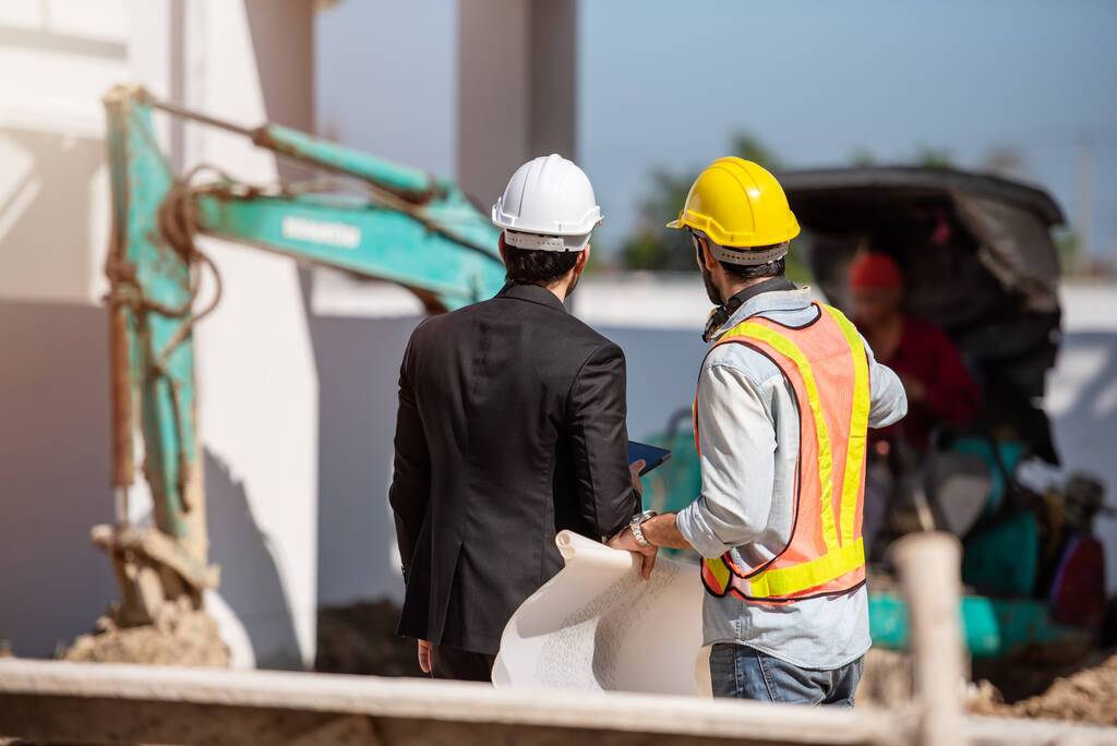 Workers discussing property development project