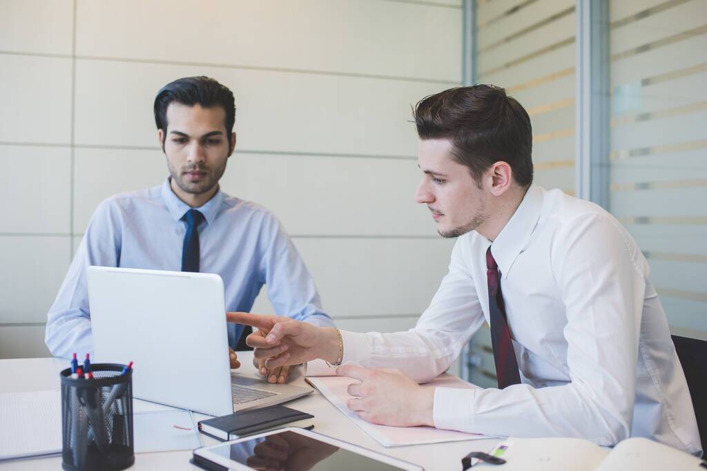 Professionals discussing business tax debt