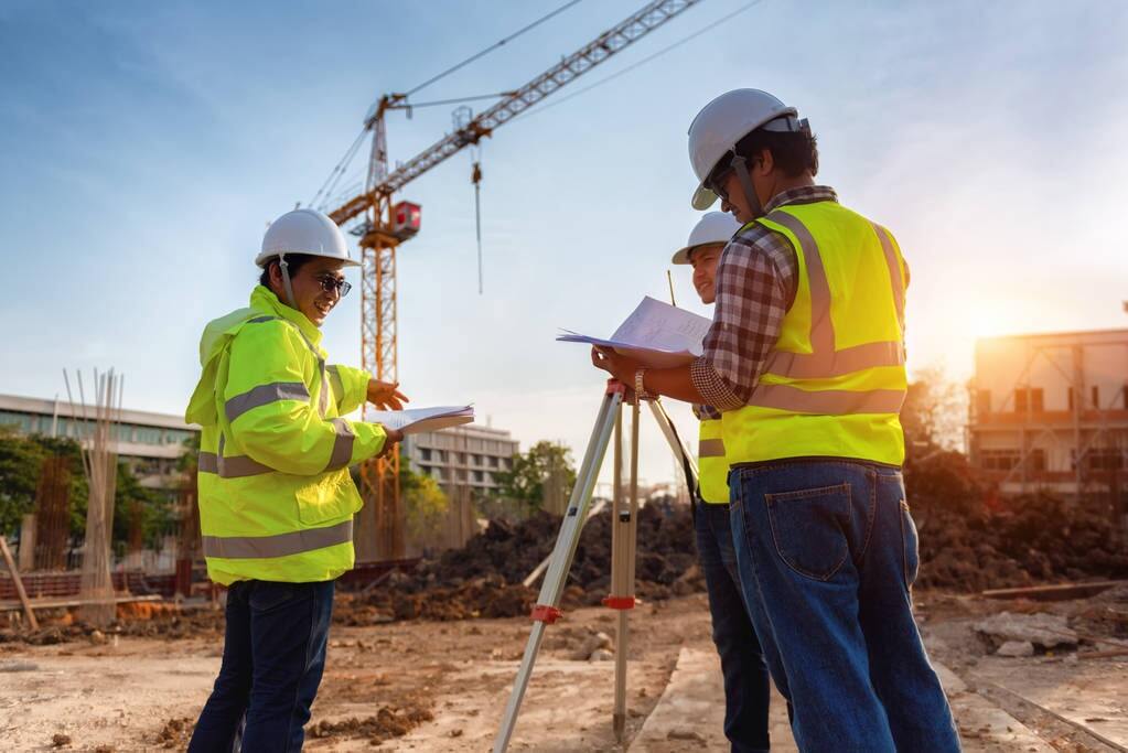 Workers discussing grants for their commercial construction business