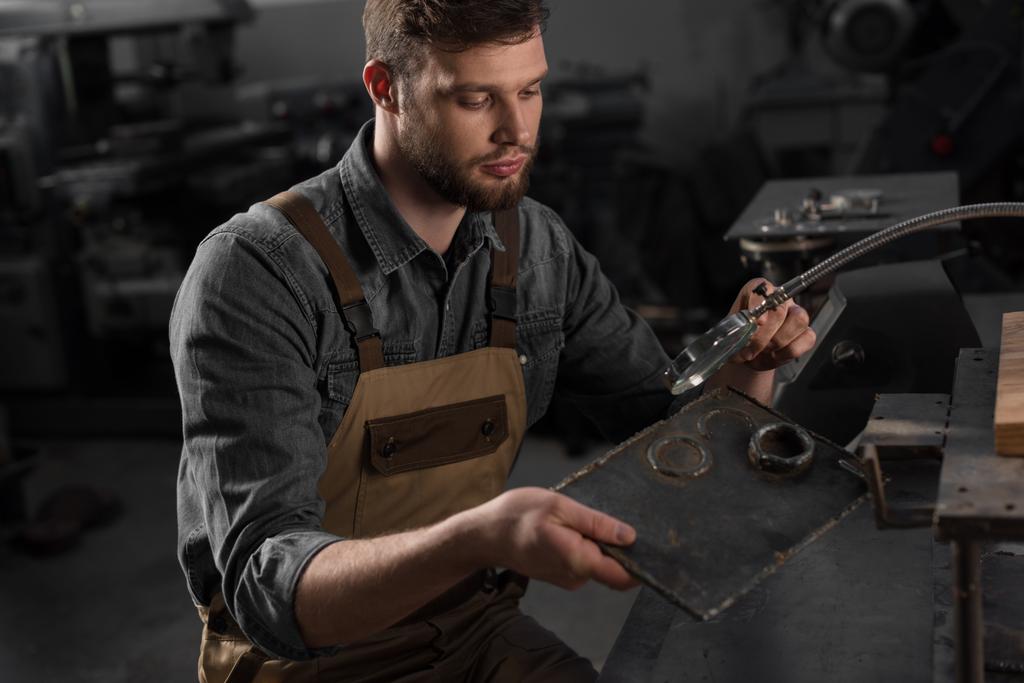 A young man at a workshop