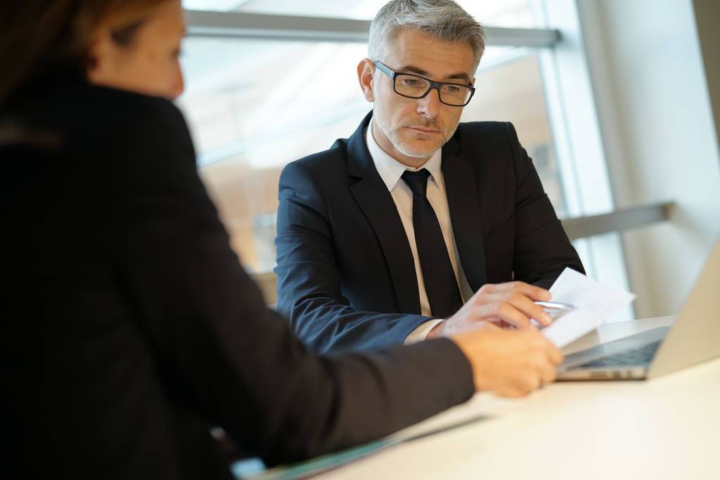 Lending expert discussing funding for retail fit-out with client