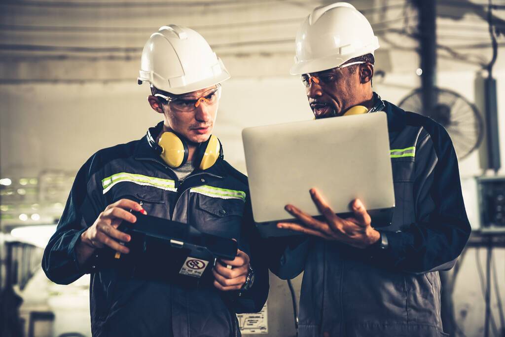 Two steel engineers looking at grants for small business