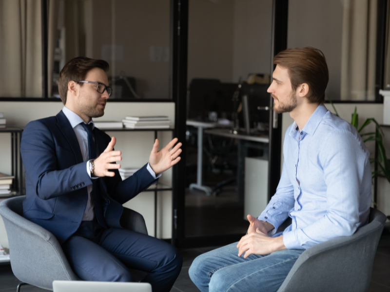 A business owner discusses a potential buyout with his business partner