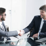 Business partners shaking hands during a meeting