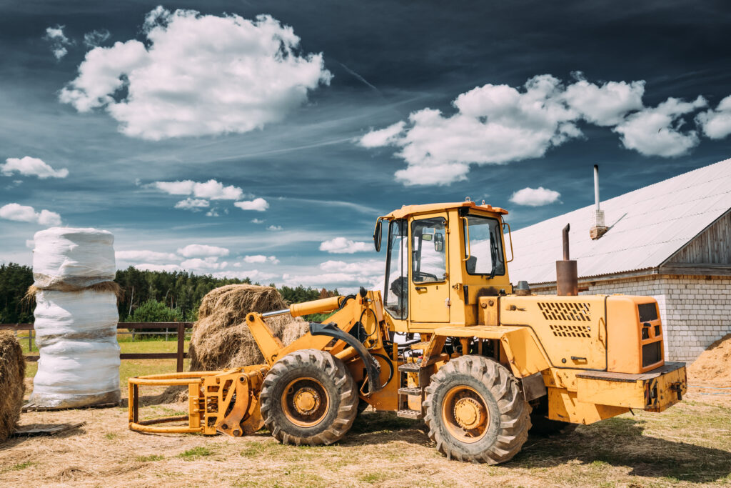 A side-view photo of a multipurpose wheel loader. Machinery is one type of security accepted by lenders for bad credit loans.