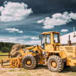 A side-view photo of a multipurpose wheel loader. Machinery is one type of security accepted by lenders for bad credit loans.