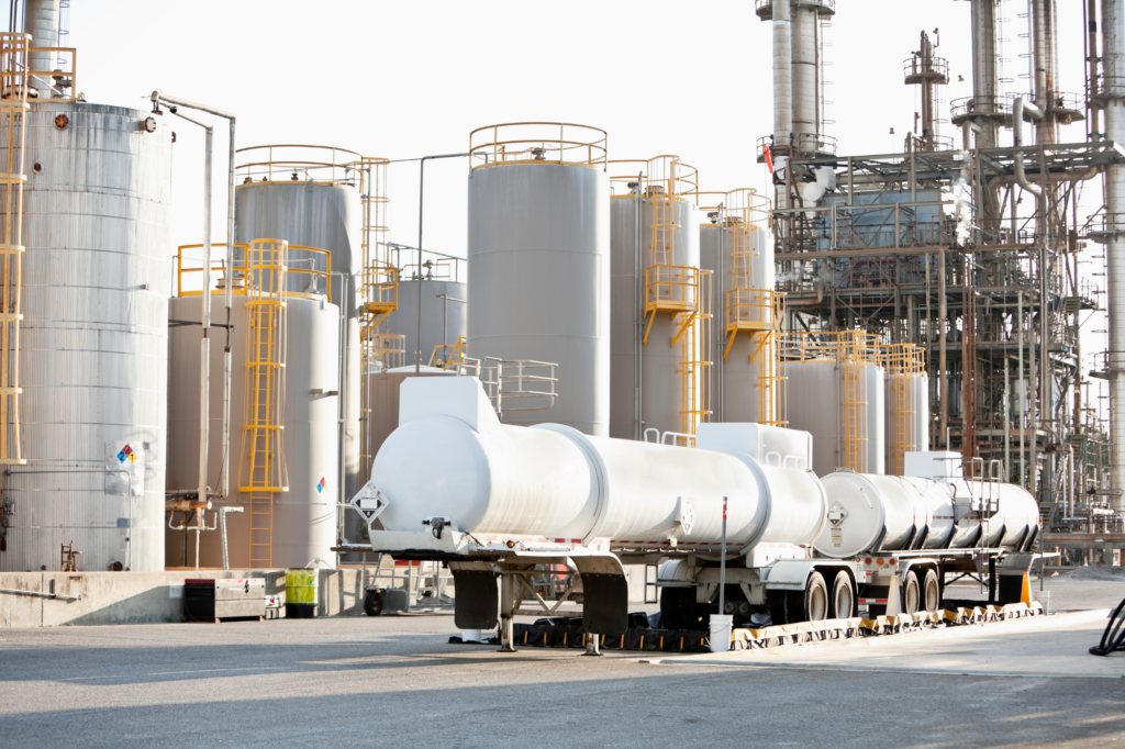 Photo of chemicals manufacturing plant with storage and vehicles