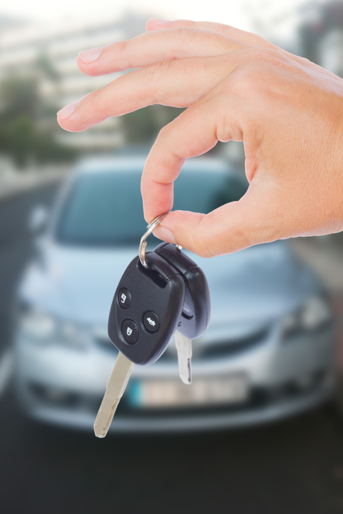 Hand showing car key after a Car loan in Australia