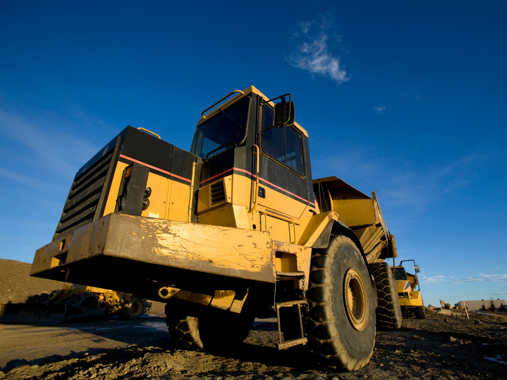 Photo of heavy machinery set against the background of a striking blue sky, concept photo of machinery financed through equipment finance