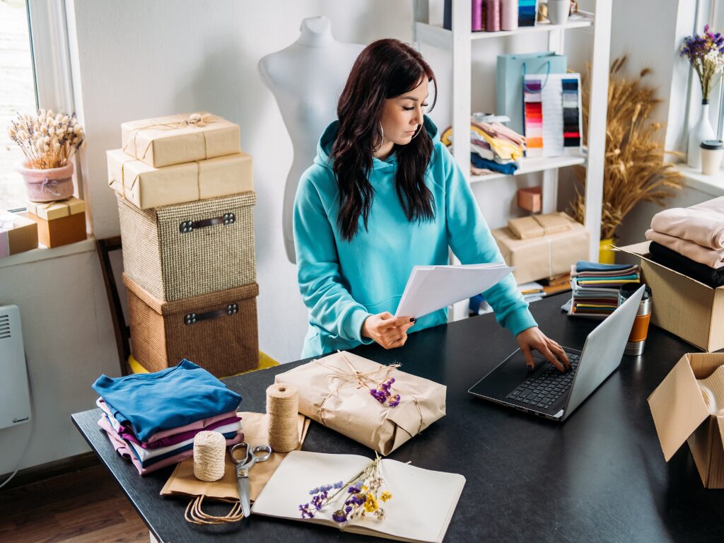 Small business owner working in her workshop after securing a quick business loan