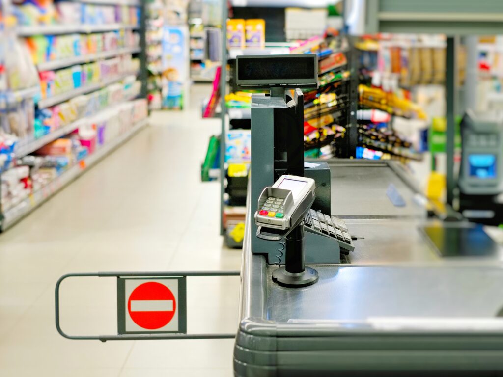 Cashier's station at a retail store, POS machine and cash register