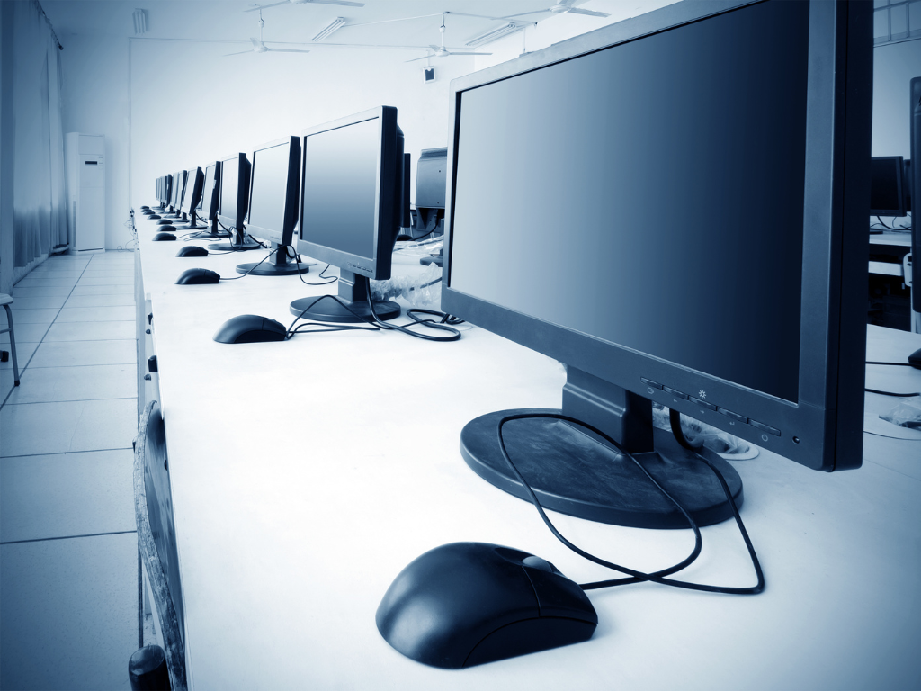 A row of computers in an office or business space, IT equipment funded by equipment finance