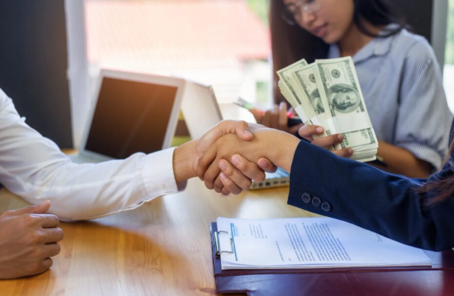 A businesswoman signing a loan agreement for store investment, securing fitout financing for retailers to upgrade her retail space.