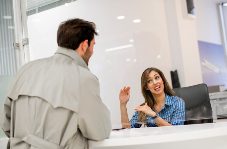 Female mortgage broker explaining types of working capital funding to a business owner.