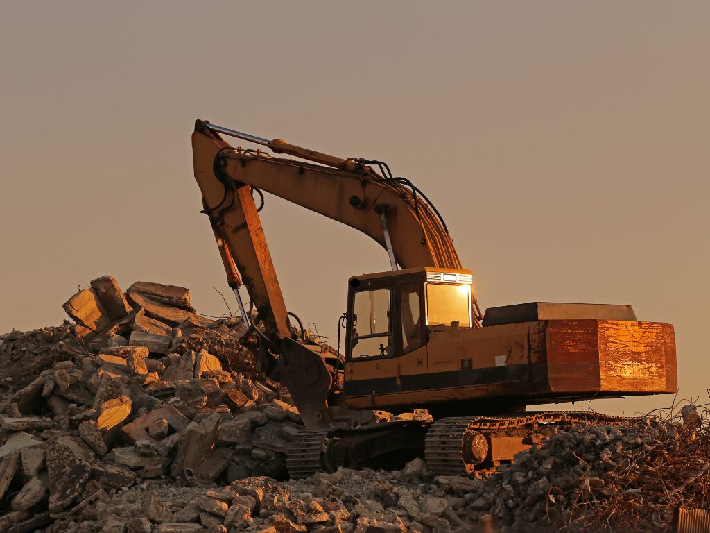 Photo of a large industrial machine, heavy machinery and equipment taken during sunset