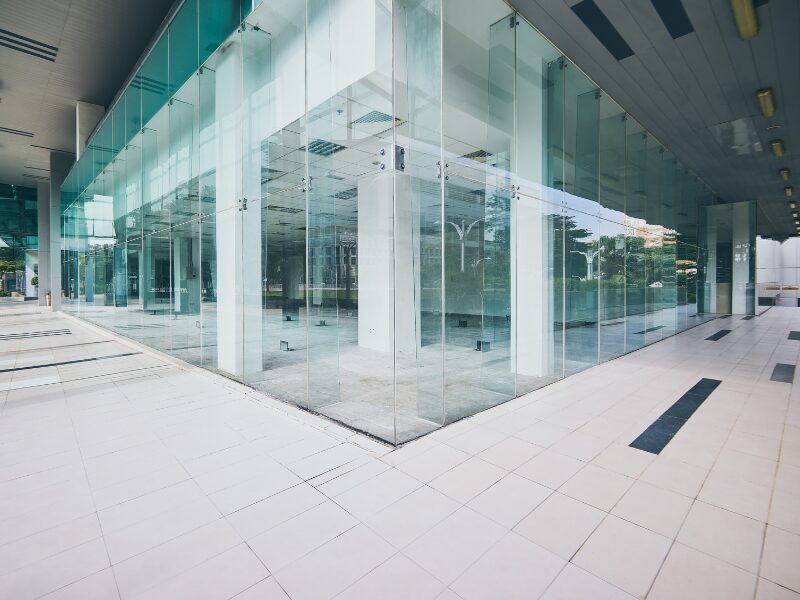 Exterior windows of the ground floor of a commercial building, floor to ceiling windows on a modern building