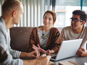 A couple discussing with a lender or lending professional, consultation for an interest-only loan