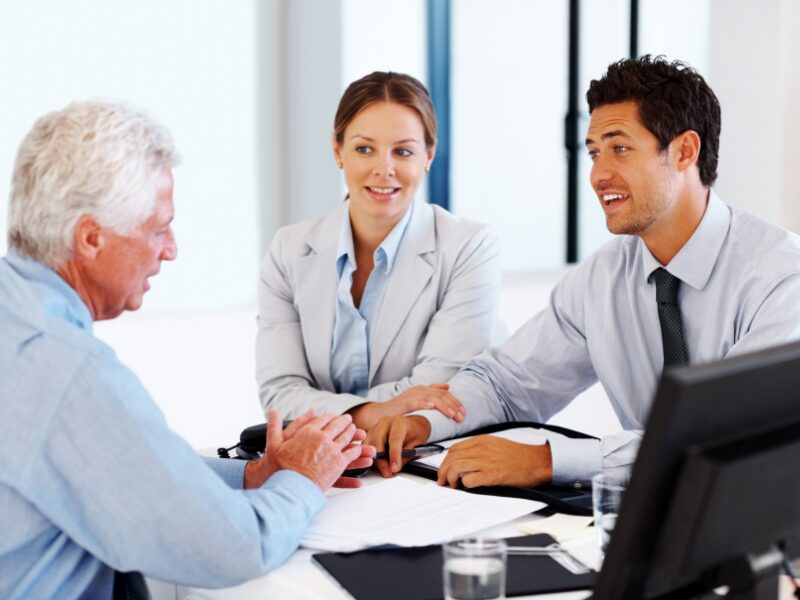 A business owner consults with mortgage brokers about wanting to switch to a tax debt loan