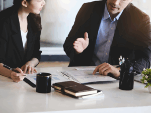 Small business owner speaking with a restructuring practitioner, facilitating small business restructuring