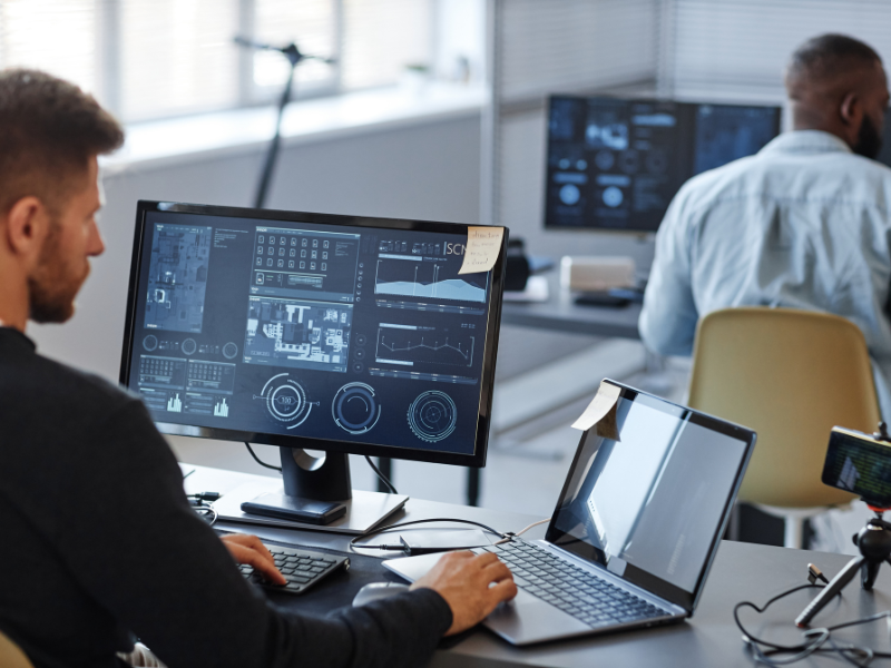 IT professionals working on their computers in an office setting
