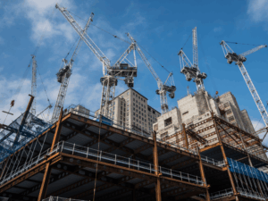 Ongoing building construction with several cranes