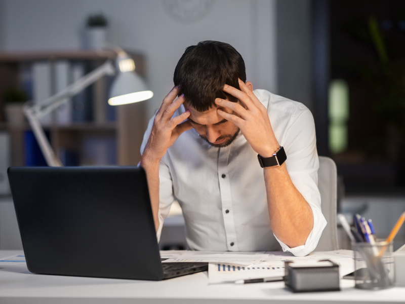 Man stressed out at his desk