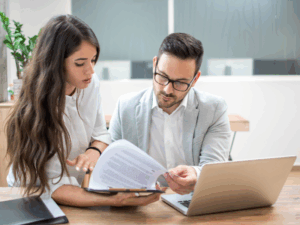 A business owner reviews documents about tax debt loans in 2026