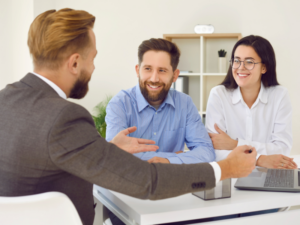 Two business owners meet with a mortgage broker to talk about working capital loan eligibility