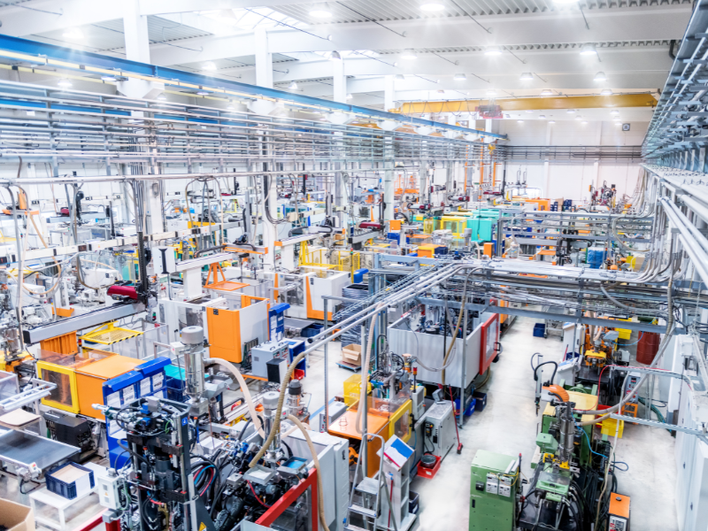 The interior of a brightly lit manufacturing plant for plastics