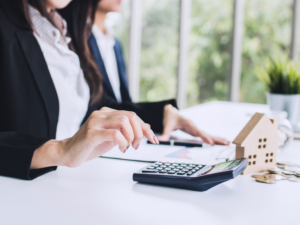 Cropped photo of woman using calculator