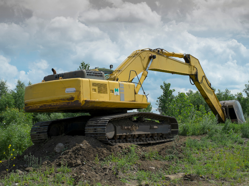 A small excavator working on land