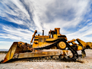 Yellow large bulldozer, construction equipment at a construction site