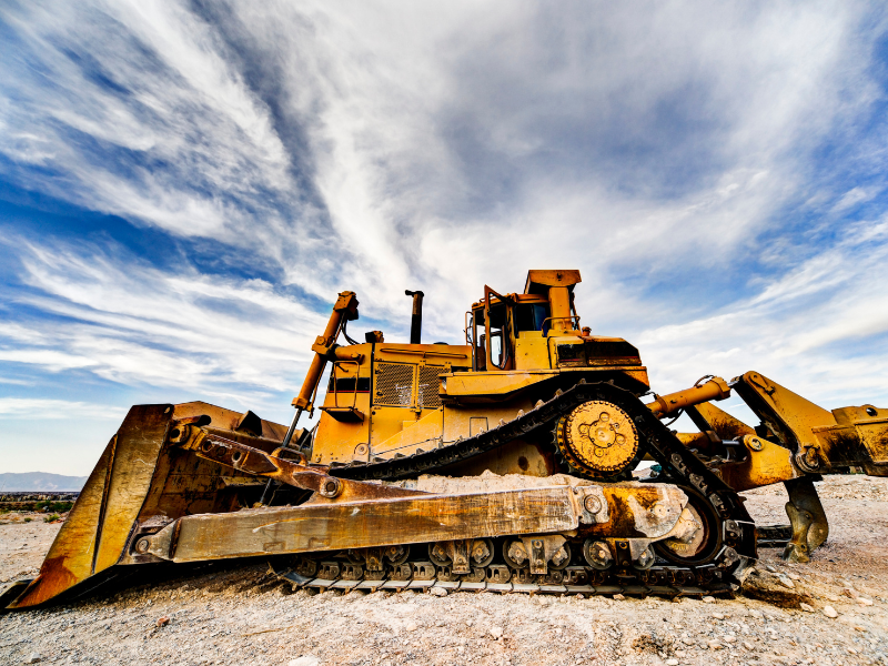 Yellow large bulldozer, construction equipment at a construction site