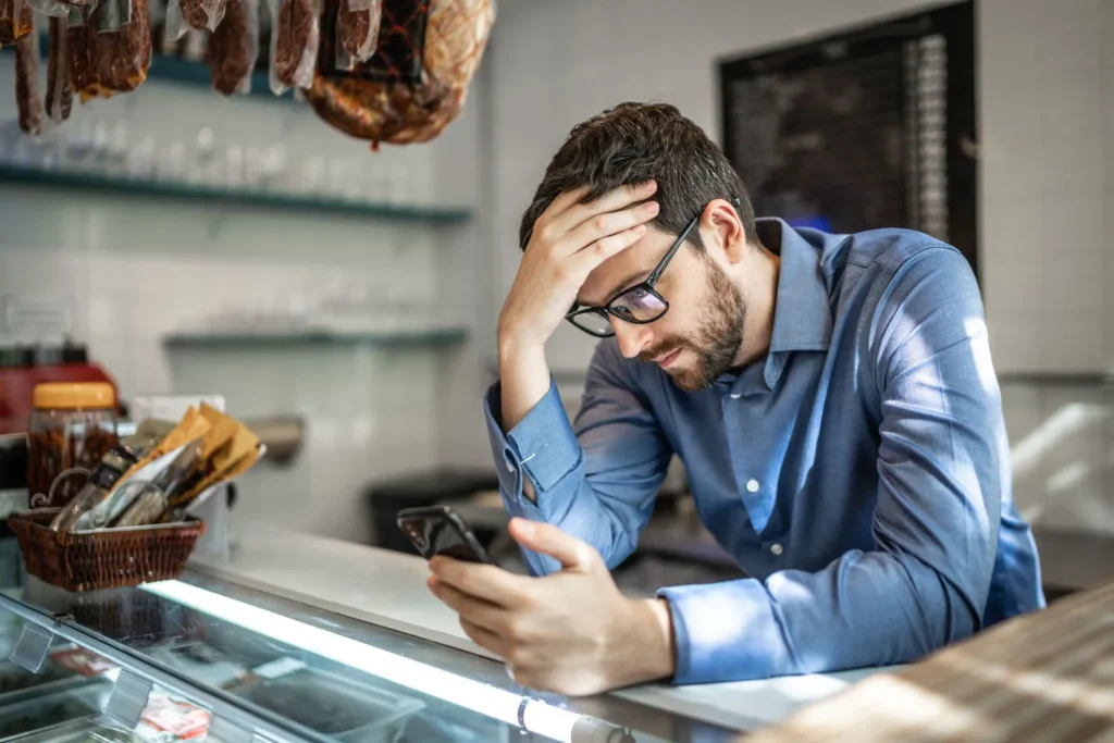 Business owner reviewing ATO payment plan and tax debt loan options on his phone